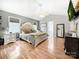 The main bedroom features ample natural light, a ceiling fan, and hardwood floors at 3232 47Th Avenue Ne Pl, Hickory, NC 28601