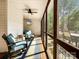 Relaxing screened porch with comfortable seating, ceiling fan, and wooded views, ideal for outdoor enjoyment at 3232 47Th Avenue Ne Pl, Hickory, NC 28601