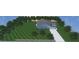 A lovely home is framed by plentiful trees with a long driveway and a well-manicured lawn at 3605 Libby Ln, Midland, NC 28107