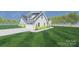 Beautiful home with a pristine driveway, lush lawn and tidy, manicured landscaping at 3605 Libby Ln, Midland, NC 28107