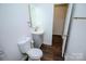 Bathroom features a vanity with sink and a toilet at 409 N Apple St, Gastonia, NC 28054