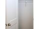 A simple, white closet featuring a rod for hanging clothes at 409 N Apple St, Gastonia, NC 28054