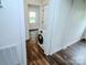 Hallway shows wood-look flooring and a washing machine at 409 N Apple St, Gastonia, NC 28054