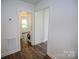 Hallway shows wood-look flooring and a washing machine at 409 N Apple St, Gastonia, NC 28054