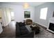 Cozy living area showcasing neutral tones, fireplace feature, and comfortable furnishings at 409 N Apple St, Gastonia, NC 28054