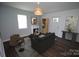 Inviting living room with a modern sofa, decorative fireplace, and stylish decor at 409 N Apple St, Gastonia, NC 28054