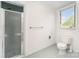 Bathroom with glass enclosed shower, toilet, and bright window at 426 Saint Michaels Way, Fort Mill, SC 29708