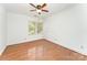 Bedroom with wood floors, ceiling fan, crown molding, and natural light at 426 Saint Michaels Way, Fort Mill, SC 29708