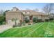 Charming brick home with well-manicured front yard and mature landscaping at 426 Saint Michaels Way, Fort Mill, SC 29708