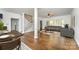 Spacious living room featuring hardwood floors, staircase, and ample natural light at 426 Saint Michaels Way, Fort Mill, SC 29708