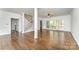 Bright living room featuring hardwood floors, staircase, and ample natural light at 426 Saint Michaels Way, Fort Mill, SC 29708
