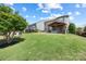 Large backyard featuring lush green lawn, patio, hot tub, and swing set at 487 Hawks Creek Pkwy, Fort Mill, SC 29708