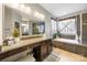 Modern bathroom features granite counters, vanity, and soaking tub for a luxurious experience at 487 Hawks Creek Pkwy, Fort Mill, SC 29708