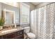 Bathroom with granite countertops, dark wood cabinets, and a shower/tub combo with a patterned curtain at 487 Hawks Creek Pkwy, Fort Mill, SC 29708