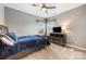 Neutral bedroom with a ceiling fan, carpeted floor, and a dresser beneath a TV at 487 Hawks Creek Pkwy, Fort Mill, SC 29708
