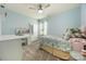 Light blue bedroom featuring carpeted floor, a ceiling fan, and a large closet at 487 Hawks Creek Pkwy, Fort Mill, SC 29708
