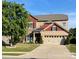 Charming two-story home with a two-car garage, landscaped yard, and a mix of stone and siding accents at 487 Hawks Creek Pkwy, Fort Mill, SC 29708