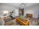 Bright living room with hardwood floors, a ceiling fan, and a second staircase is also visible at 487 Hawks Creek Pkwy, Fort Mill, SC 29708