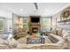 Cozy living room with a stone fireplace, neutral decor, hardwood floors, and plenty of natural light at 487 Hawks Creek Pkwy, Fort Mill, SC 29708