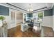 Bright office space with hardwood flooring, wainscoting, and a large window offering ample natural light at 487 Hawks Creek Pkwy, Fort Mill, SC 29708