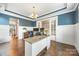 Well-lit office features hardwood floors, wainscoting, and neutral decor with a view at 487 Hawks Creek Pkwy, Fort Mill, SC 29708