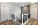 Modern staircase with decorative accent wall, iron balusters and bright natural light at 487 Hawks Creek Pkwy, Fort Mill, SC 29708