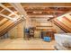 Spacious attic with exposed beams, wood paneled walls and flooring at 4896 Pageland Hwy, Lancaster, SC 29720
