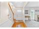 Inviting entryway with hardwood floors, staircase, and view into carpeted living space at 4896 Pageland Hwy, Lancaster, SC 29720