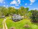 Charming white farmhouse with a cozy front porch and lush, well-maintained landscaping at 4896 Pageland Hwy, Lancaster, SC 29720