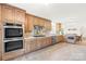 Spacious kitchen featuring stainless steel appliances and custom cabinetry at 4896 Pageland Hwy, Lancaster, SC 29720