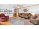 Cozy living room featuring hardwood floors, a plush sofa, and a built-in bookcase at 4896 Pageland Hwy, Lancaster, SC 29720