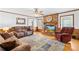 Inviting living room with a brick fireplace, plush seating, and natural light at 4896 Pageland Hwy, Lancaster, SC 29720