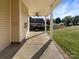 Comfortable porch with ceiling fan with an exterior view of the landscape at 5104 Shannamara Dr, Matthews, NC 28104