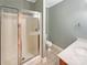 Bathroom featuring a glass-enclosed shower, toilet, and sink with a vanity, designed for functionality and style at 5104 Shannamara Dr, Matthews, NC 28104