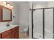 Modern bathroom features sleek glass shower, tiled floors, and contemporary fixtures at 557 Luther Dr, Iron Station, NC 28080