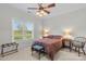 Bedroom featuring a large window overlooking the front yard and a queen bed with matching side tables at 557 Luther Dr, Iron Station, NC 28080