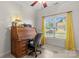 Bedroom with a vintage roll top desk, neutral carpet, and a ceiling fan at 557 Luther Dr, Iron Station, NC 28080