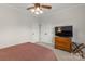 Cozy bedroom with a double door closet, dresser, and ceiling fan at 557 Luther Dr, Iron Station, NC 28080