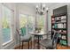 Cozy breakfast nook has large windows, comfortable seating, and a built-in bookshelf at 557 Luther Dr, Iron Station, NC 28080