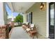 Comfortable front porch with ceiling fan, outdoor furniture, and great curb appeal at 557 Luther Dr, Iron Station, NC 28080