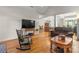 Open concept living room with hardwood floors, ample seating, and lots of natural light at 557 Luther Dr, Iron Station, NC 28080