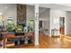 Bright living room featuring hardwood floors, stone fireplace and open floor plan at 557 Luther Dr, Iron Station, NC 28080