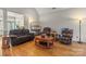 Comfortable living room featuring lots of seating and a bright and sunny atmosphere at 557 Luther Dr, Iron Station, NC 28080