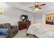 Spacious primary bedroom features plush carpet, a sitting area, and a ensuite bathroom at 557 Luther Dr, Iron Station, NC 28080