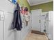 Mud room with wainscoting, storage hooks, and exterior door access at 557 Luther Dr, Iron Station, NC 28080