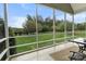 Inviting sunroom with large windows showcasing the lush green lawn and landscape at 557 Luther Dr, Iron Station, NC 28080