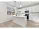 Modern kitchen with a center island, stainless steel appliances, and bright natural light at 628 Old Salisbury Rd, Statesville, NC 28677