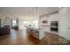 Modern kitchen featuring a center island with stool seating and stainless steel appliances at 7035 Butternut Oak Ter, Huntersville, NC 28078