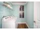 Well-lit laundry room with modern machines and ample storage space at 7035 Butternut Oak Ter, Huntersville, NC 28078