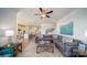 Bright and airy living room with ceiling fan, seamlessly connected to the modern kitchen area at 7035 Butternut Oak Ter, Huntersville, NC 28078